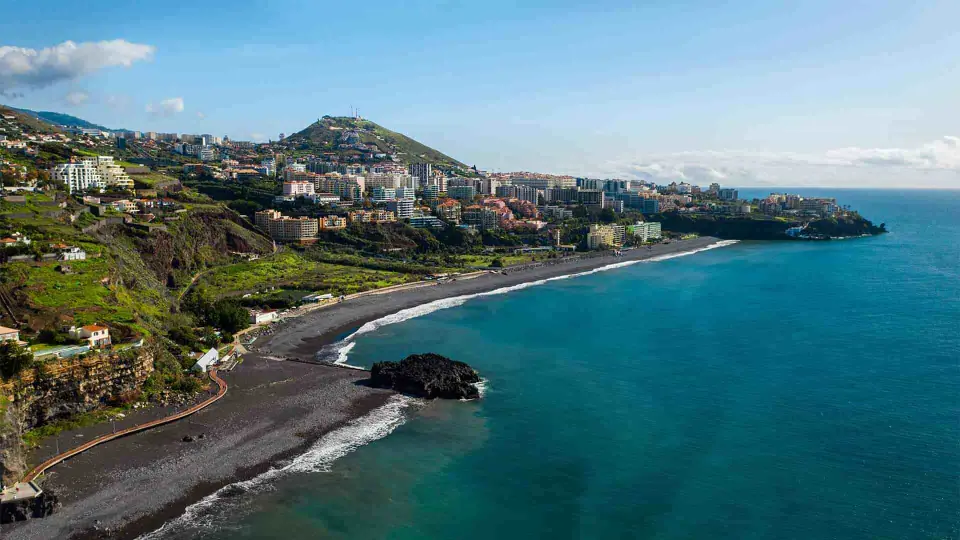 Praia Formosa beach and seafront promenade in Funchal